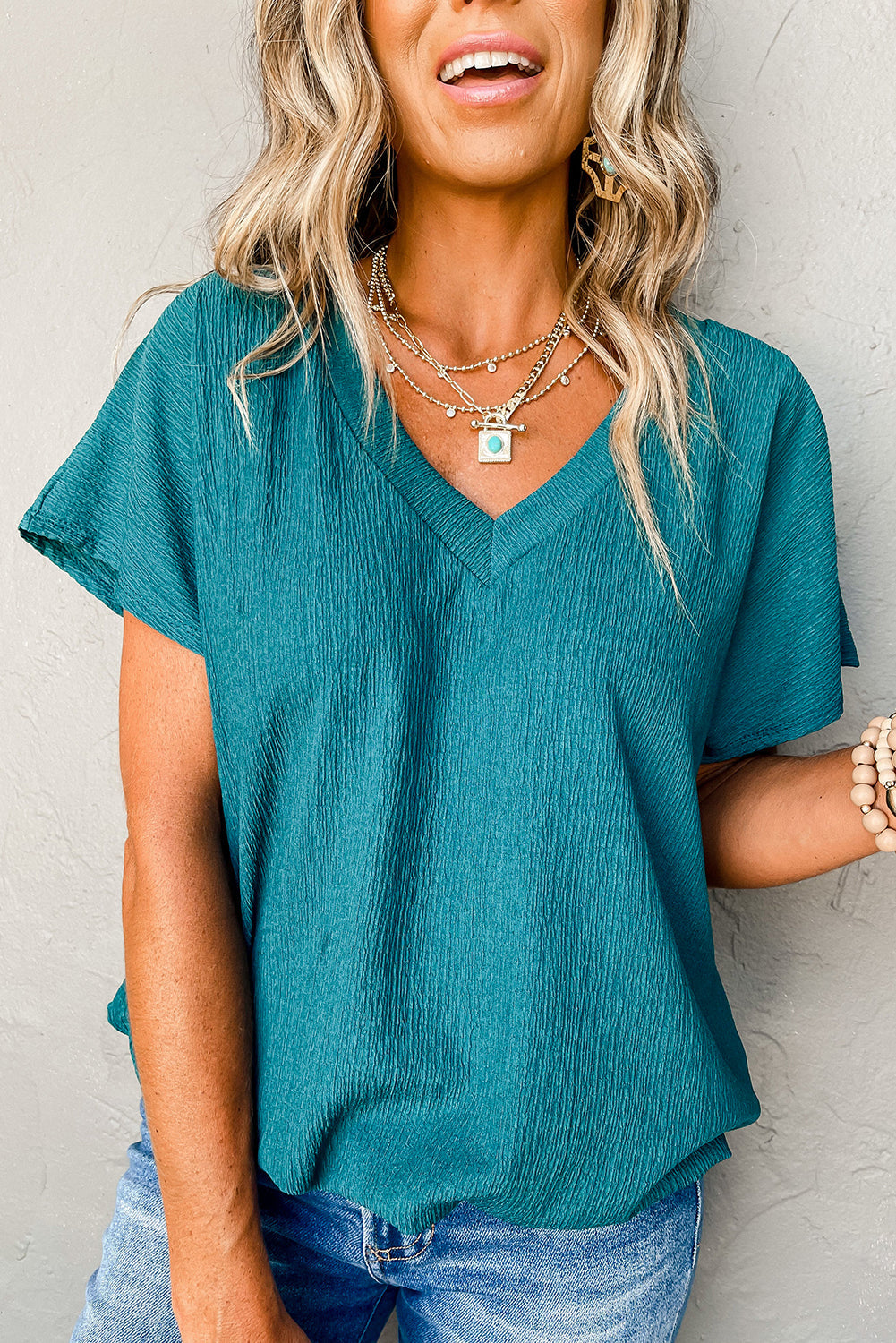 Blue crinkled blouse, flounce sleeves.