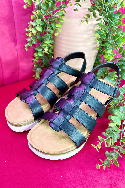 Wedge sandals with sleek straps.