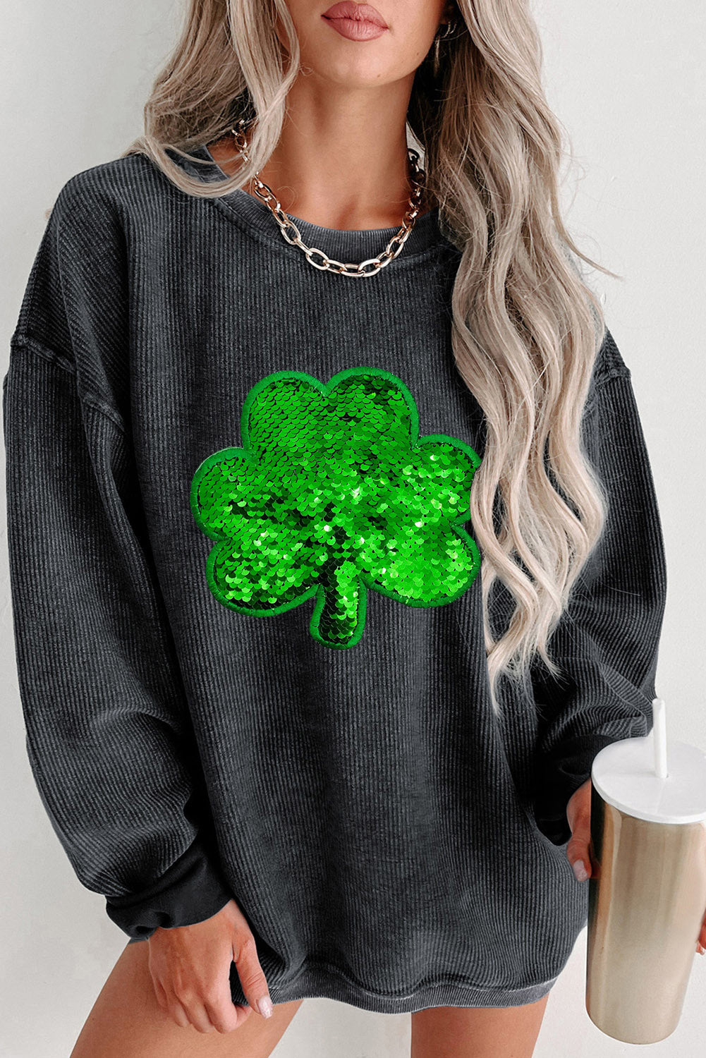 Black sweatshirt with sequin clover