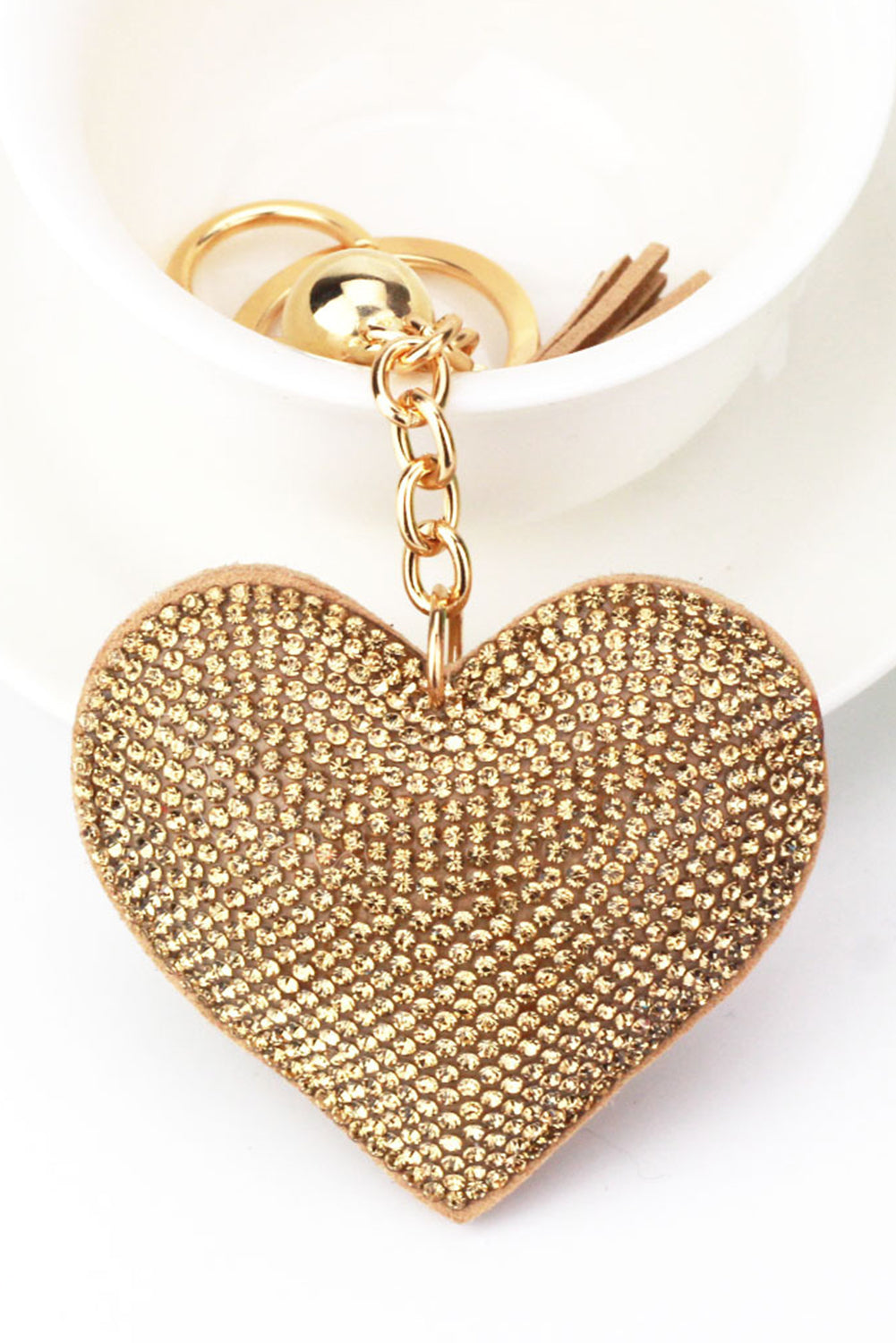 Golden key ring with rhinestone heart.