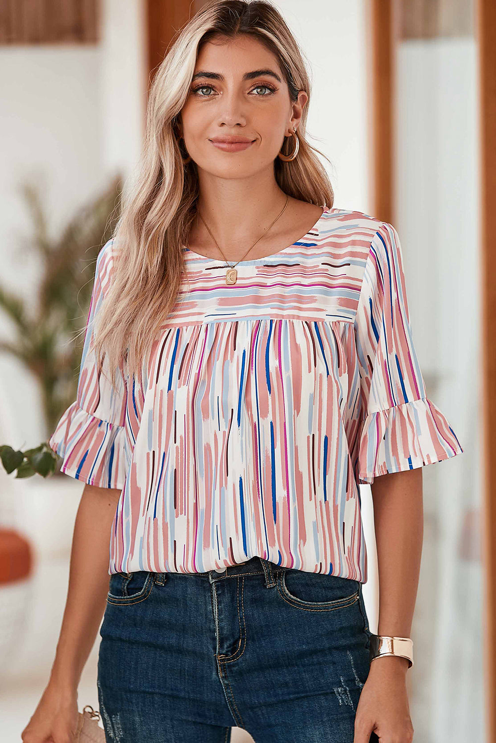 Half-sleeve blouse with striped ruffles