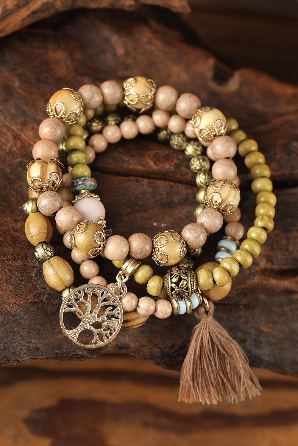 Layered wood bead bracelet with charm.