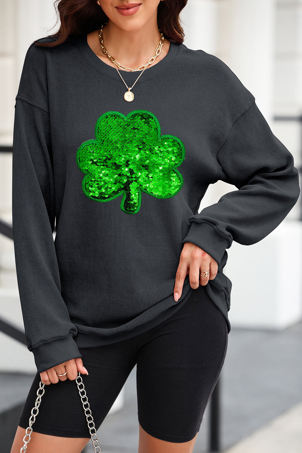 Black sweatshirt with sequin clover