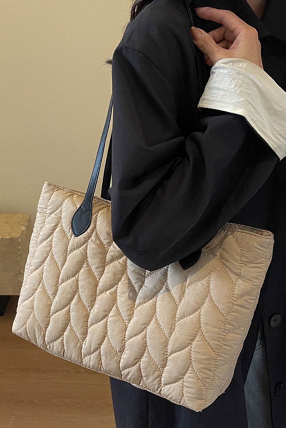 Elegant quilted beige shoulder bag.