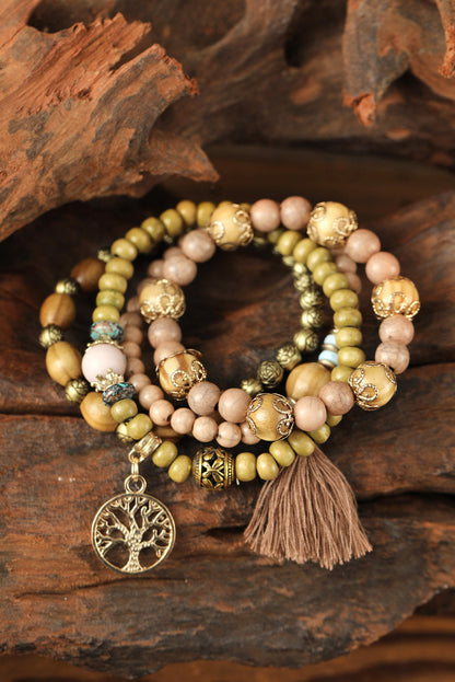 Layered wood bead bracelet with charm.