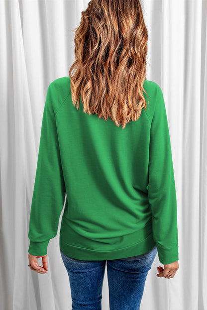 Green raglan sweatshirt with lucky clover