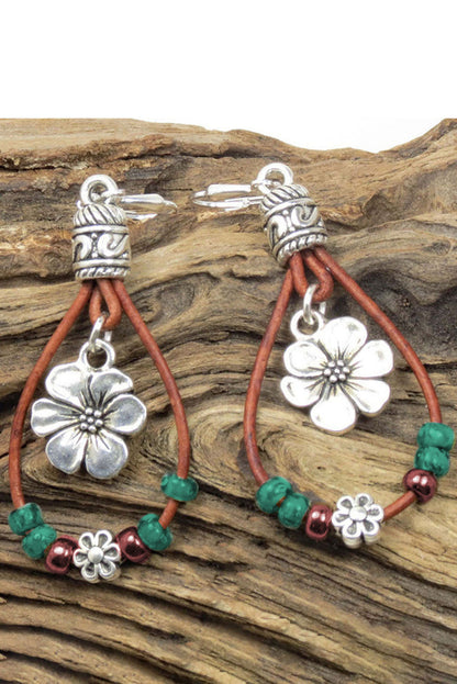 Floral dangle earrings, silvery leather.