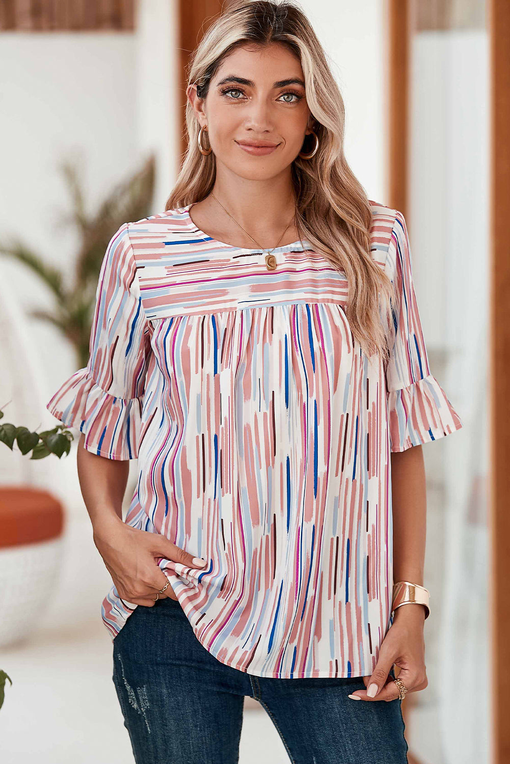 Half-sleeve blouse with striped ruffles