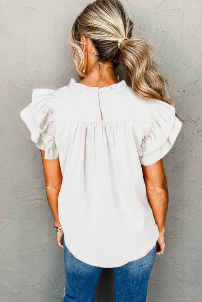 Blouse with ruched, frilled neck