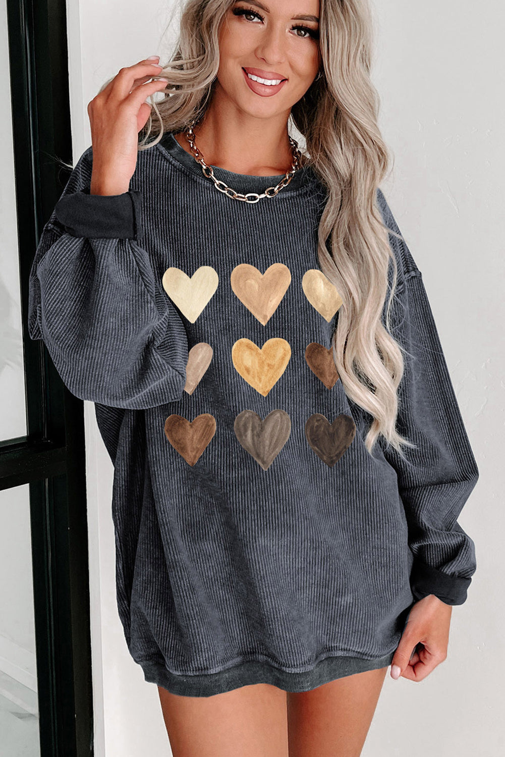 Gray sweatshirt with heart graphic